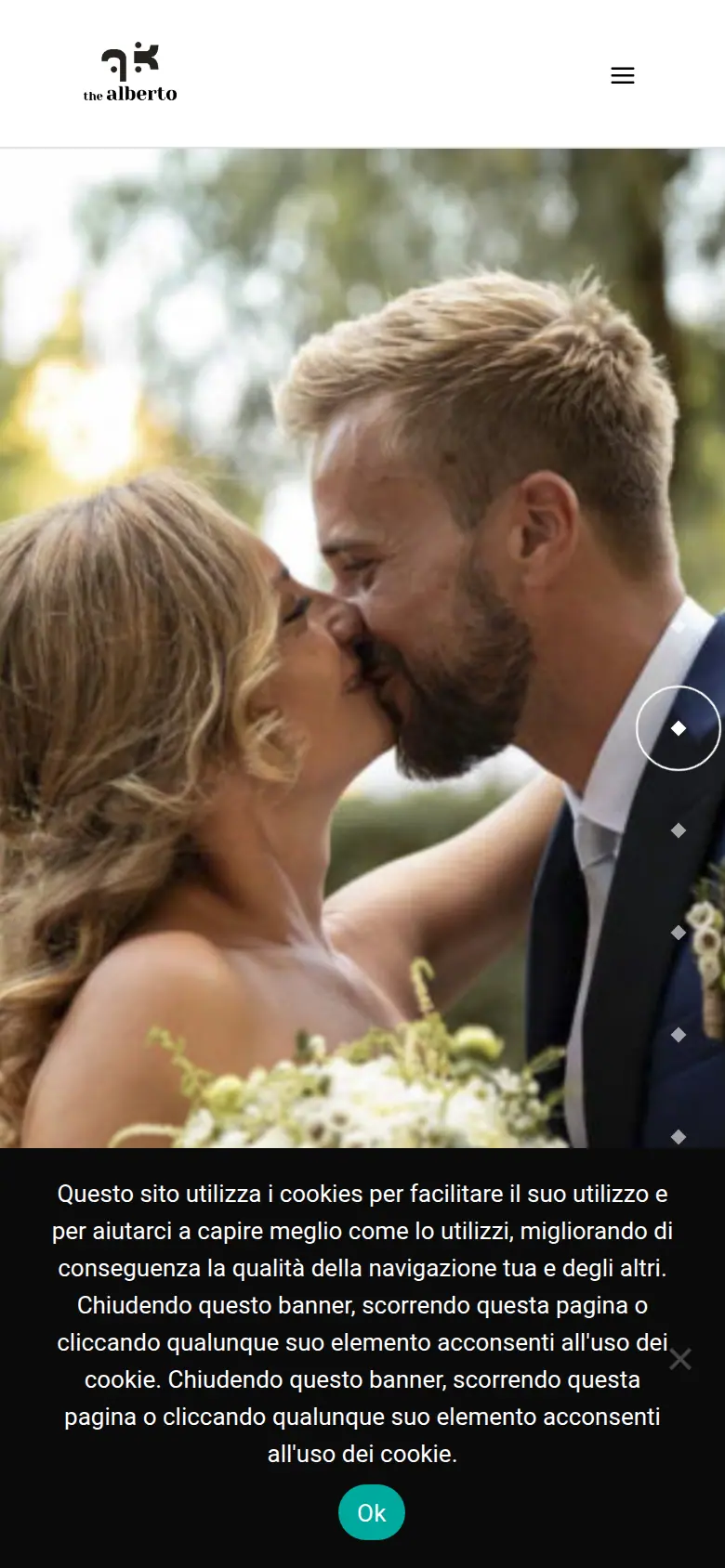 La prima schermata del sito di oggi al telefono: una bella foto di coppia, e il banner dei cookie che copre il terzo in basso